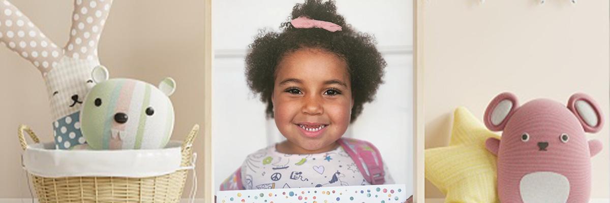 4-year-old girl smiling at camera